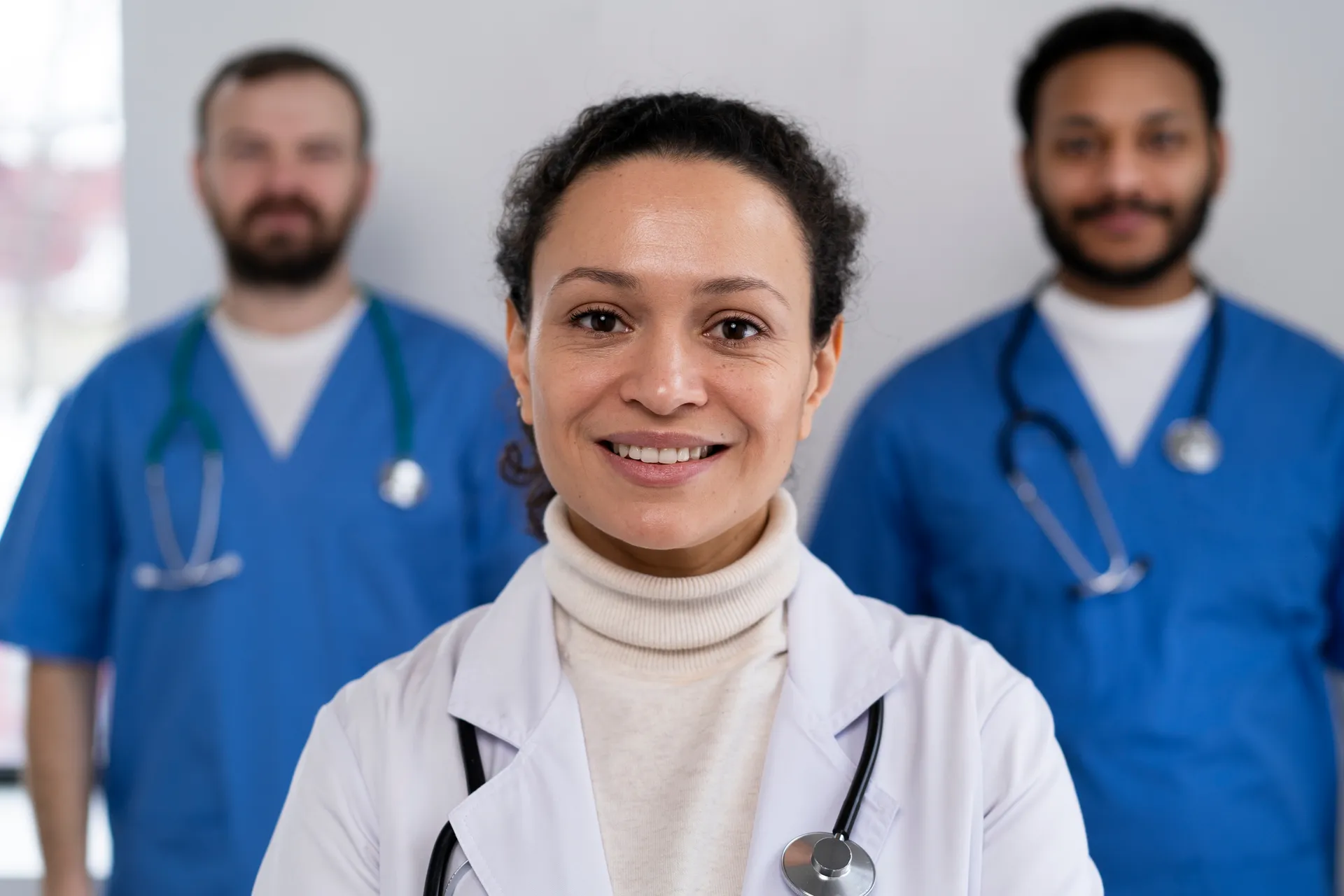 Healthcare professionals standing together in a care setting