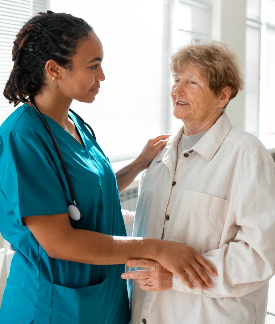 Healthcare worker supporting an older adult