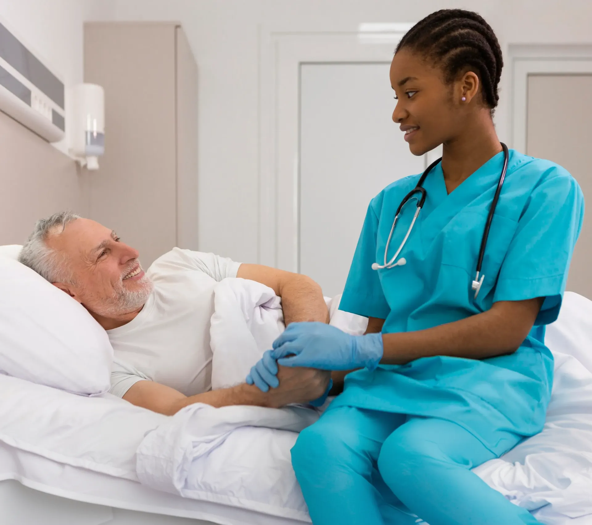 Nurse assisting a patient in a care setting